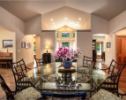 Looking from the dining area into the kitchen, the vaulted ceilings open the space.