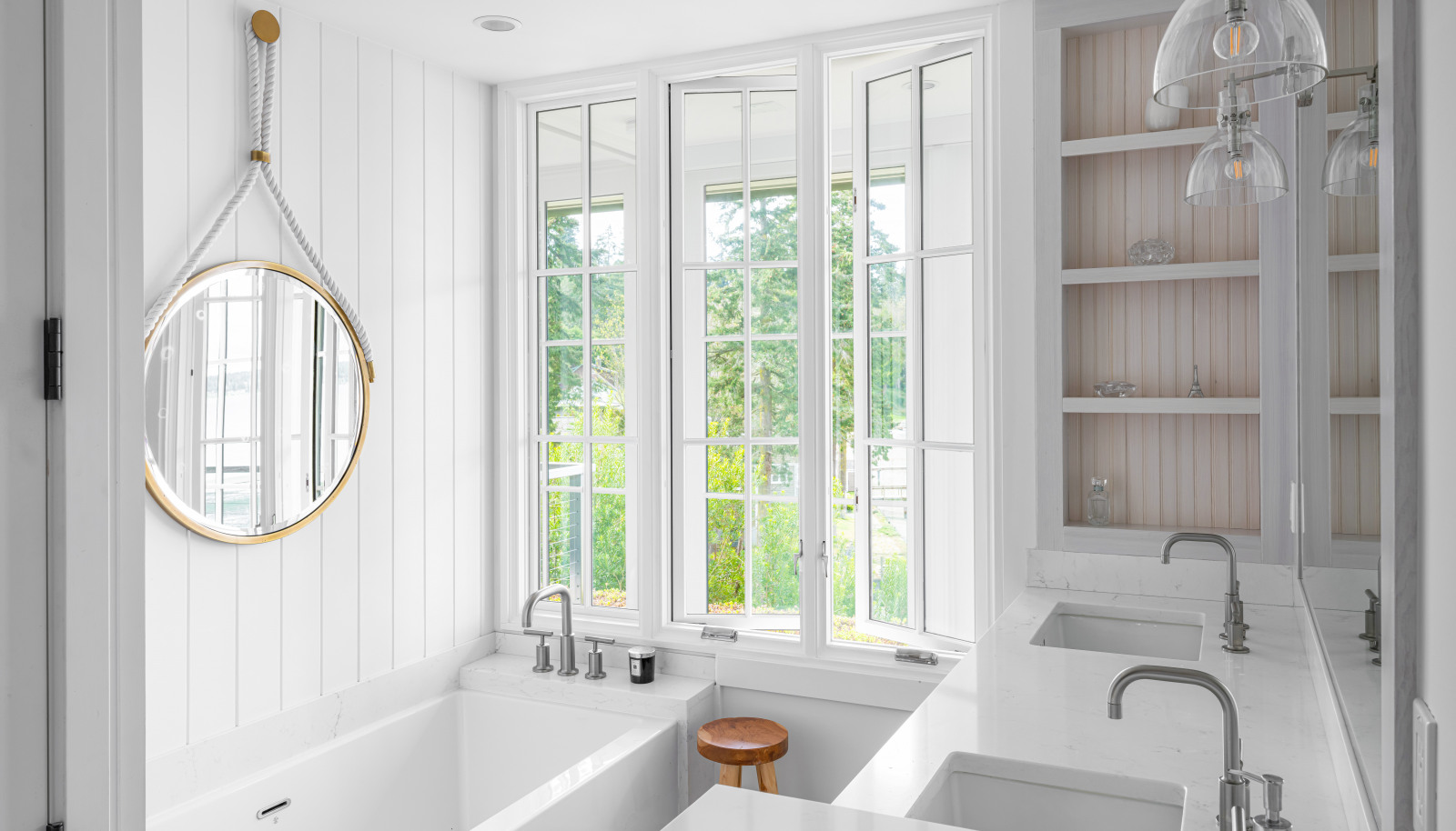 The five-piece bathroom offers a BainUltra “Citi” spa tub, a custom tiled shower stall.