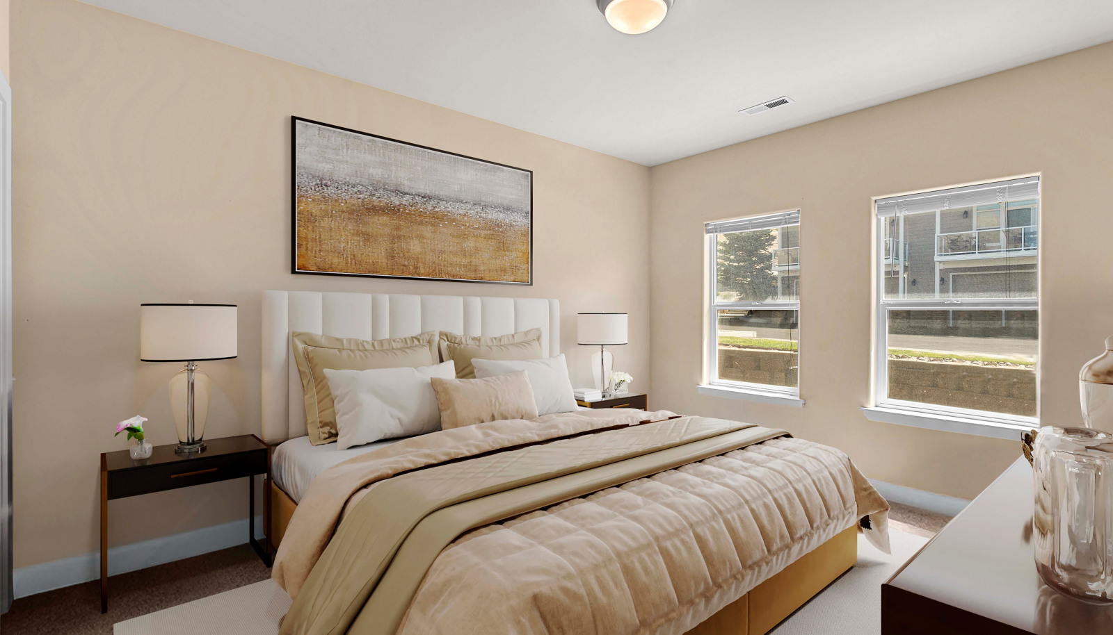 Comfortable secondary bedroom with soft natural light and ample closet space