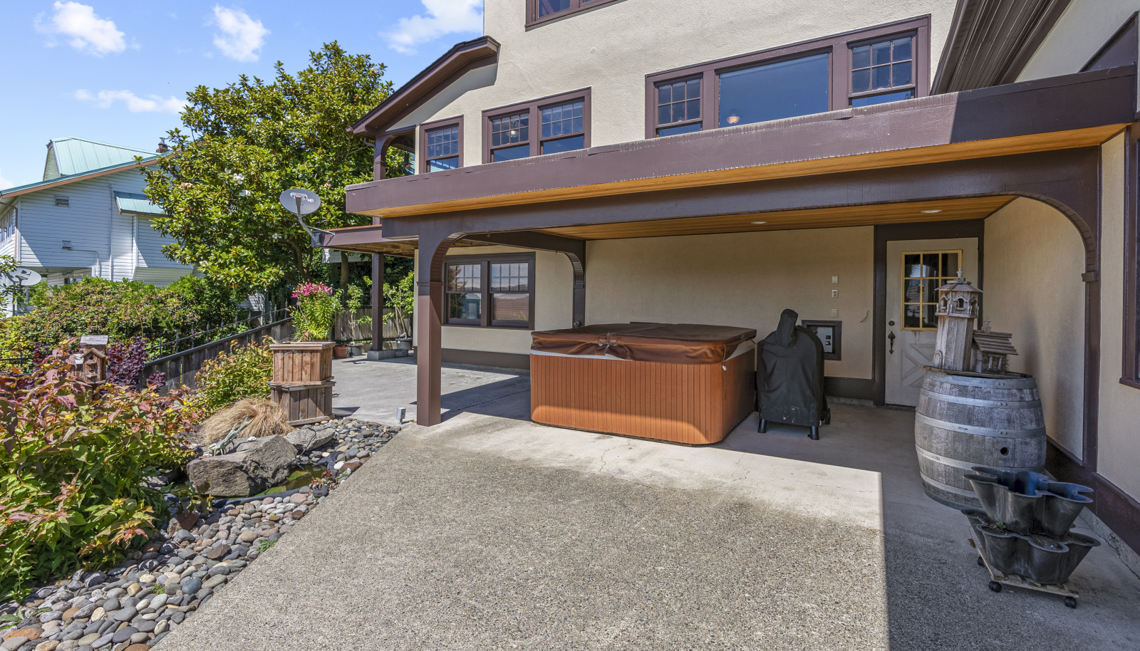 Lower level entry and covered hot tub for year round relaxation