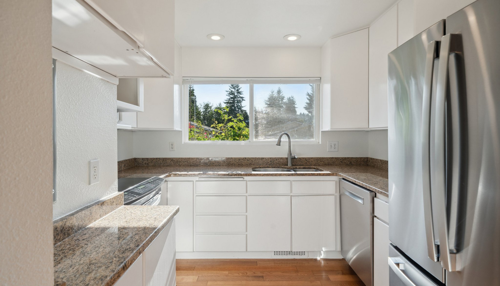 Updated kitchen with high end appliances, granite counters and extra tall cabinets for great storage!