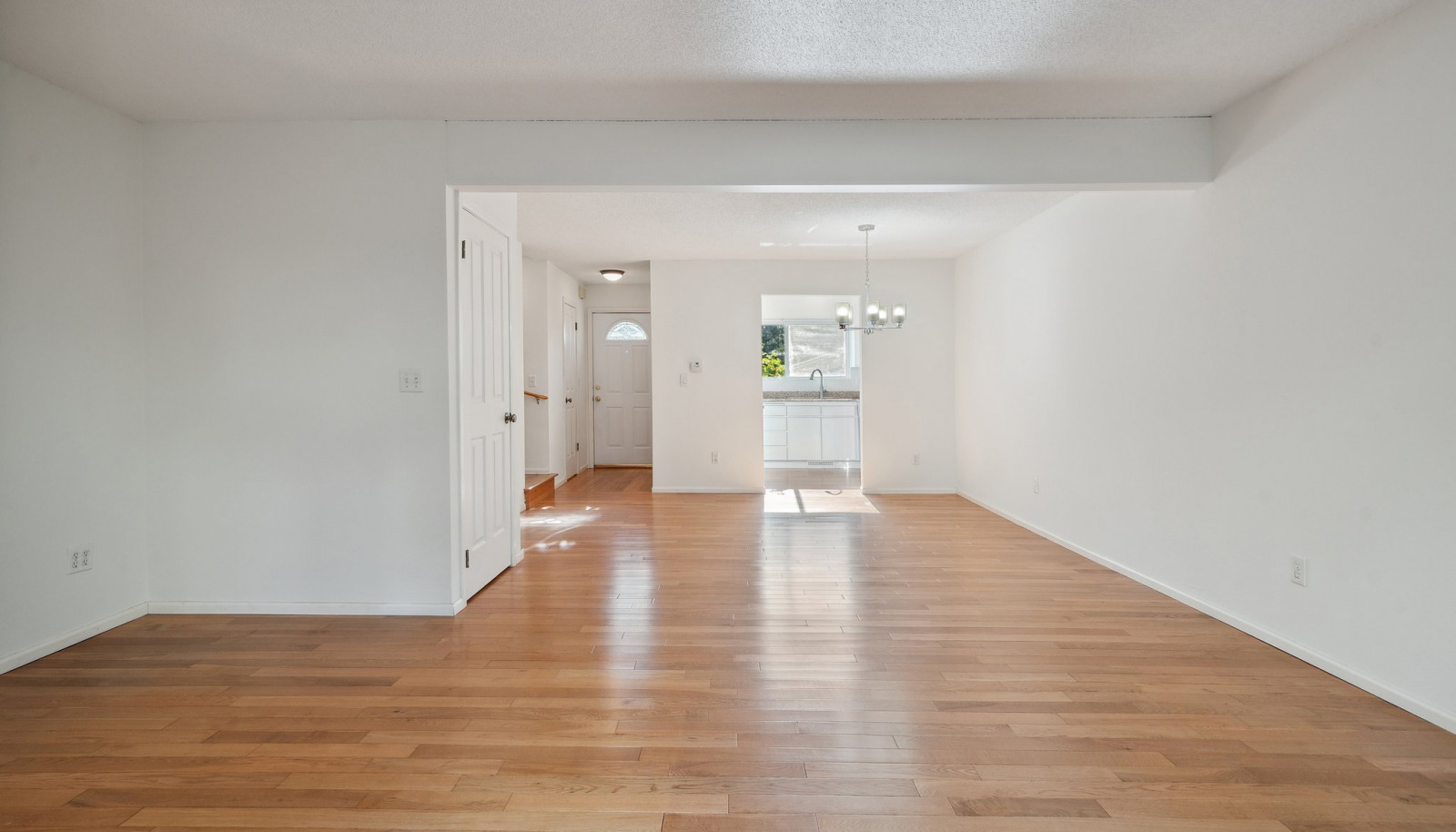 View towards kitchen and entry from slider off deck.