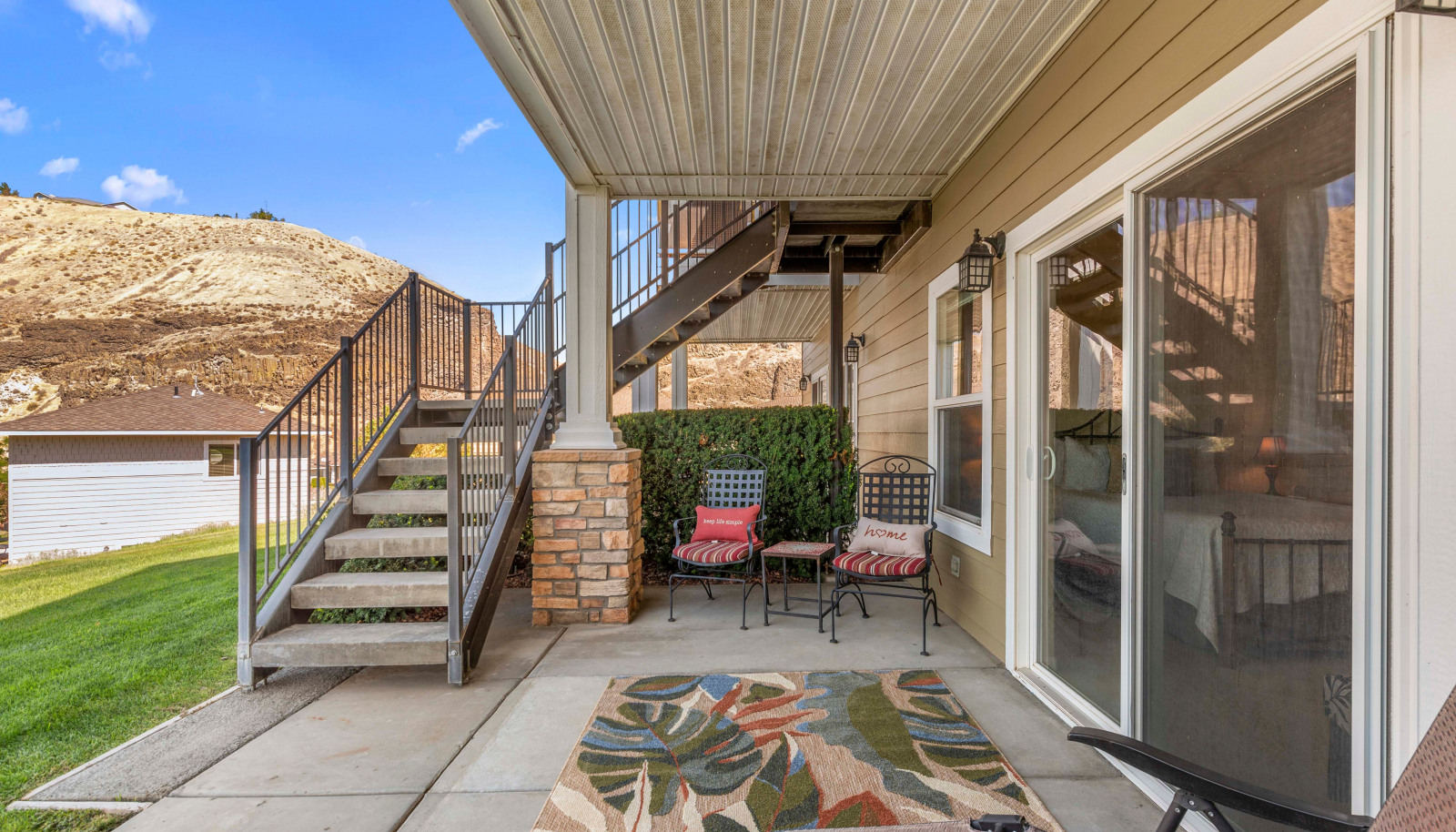 Extended patio with shade cover for year-round enjoyment and gatherings