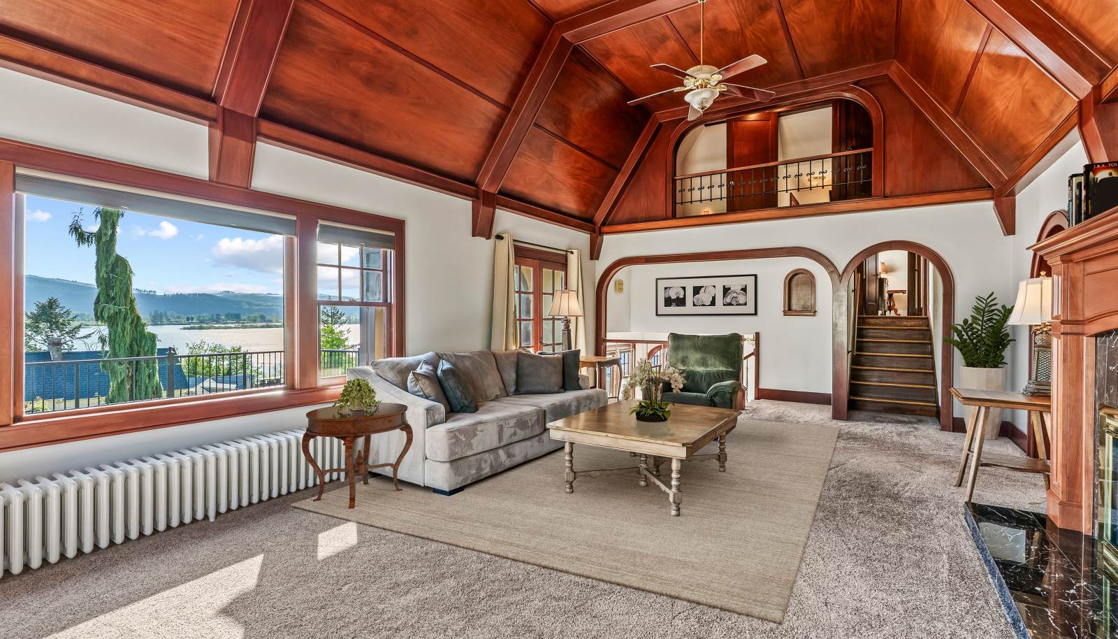 Stunning mahogany paneling and millworker frame the expansive windows, taking in the light and the views