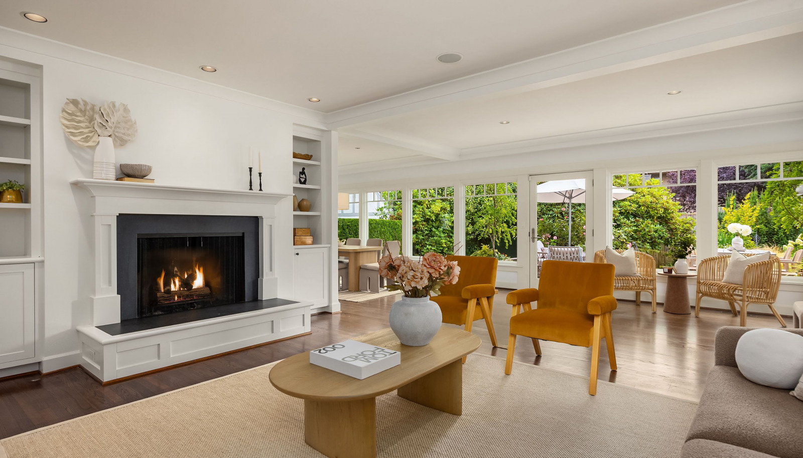 Living room and a wall of windows along the back of the home flood this home with sunshine and light.
