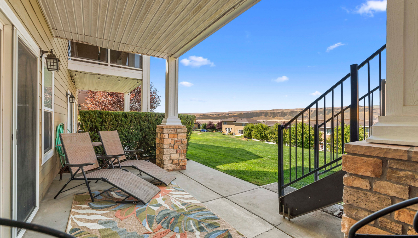 Covered outdoor living space with expansive views - perfect for lounging or dining