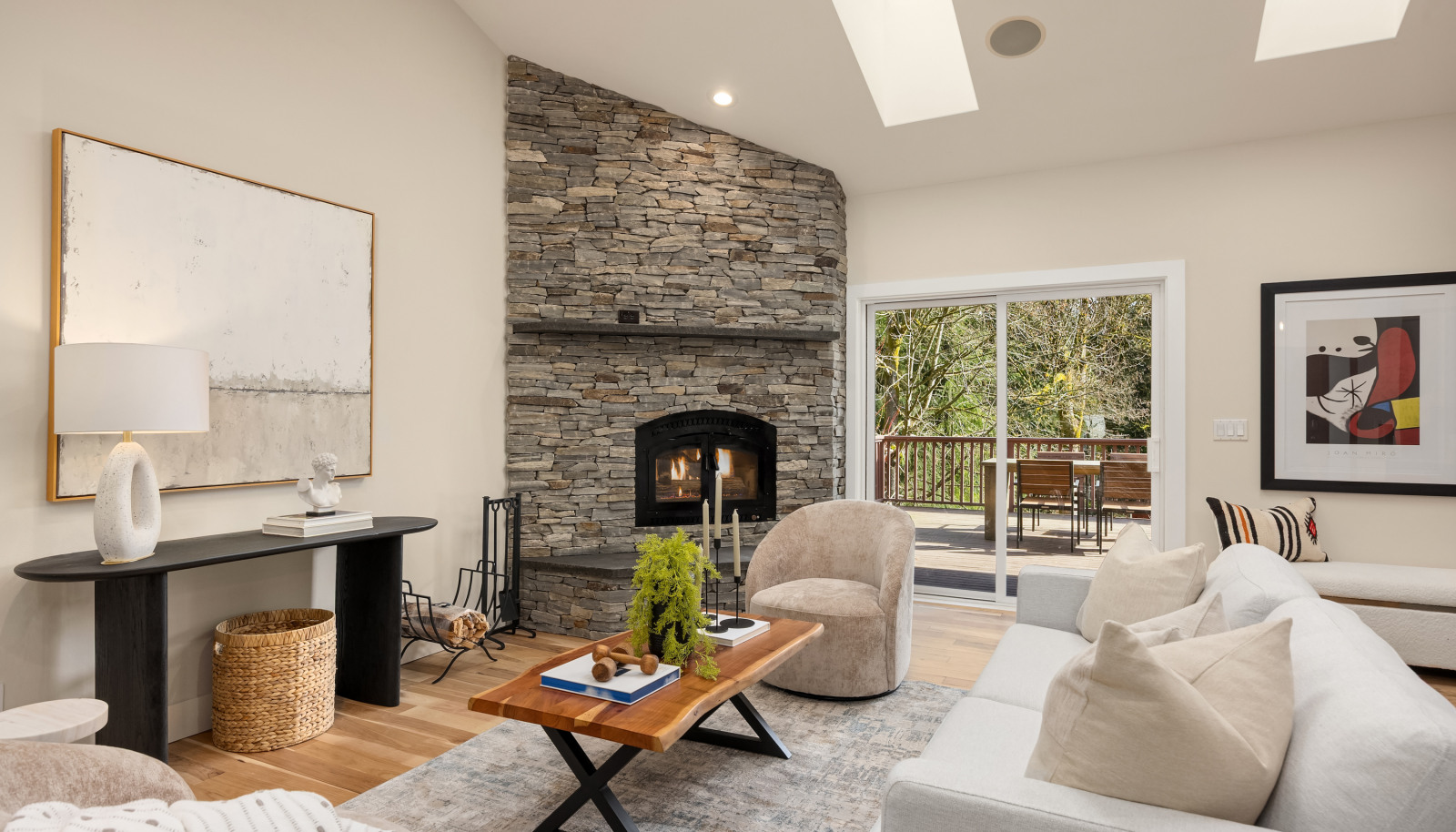 Cozy wood burning fireplace and a slider to the 576 square foot garden and and lawn view deck. Seamless indoor/outdoor living.