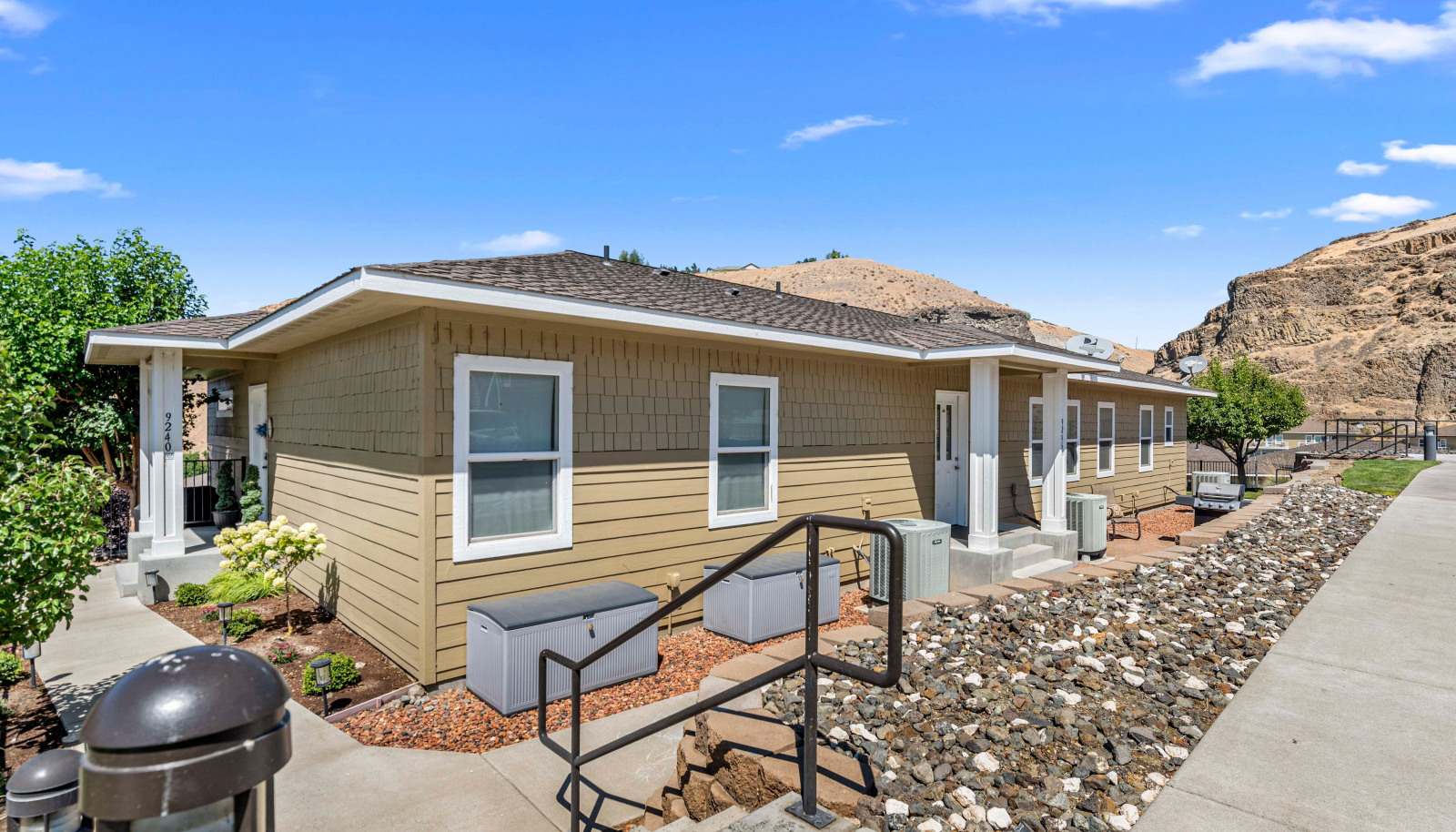 Front building elevation with stylish architectural lines and private entrance