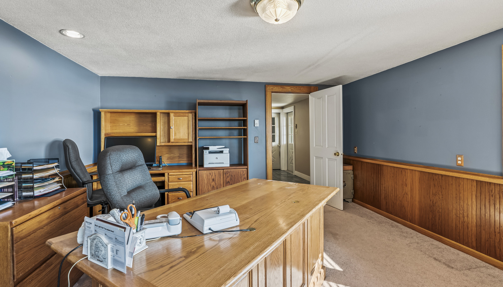 Lower level office with mahogany paneling