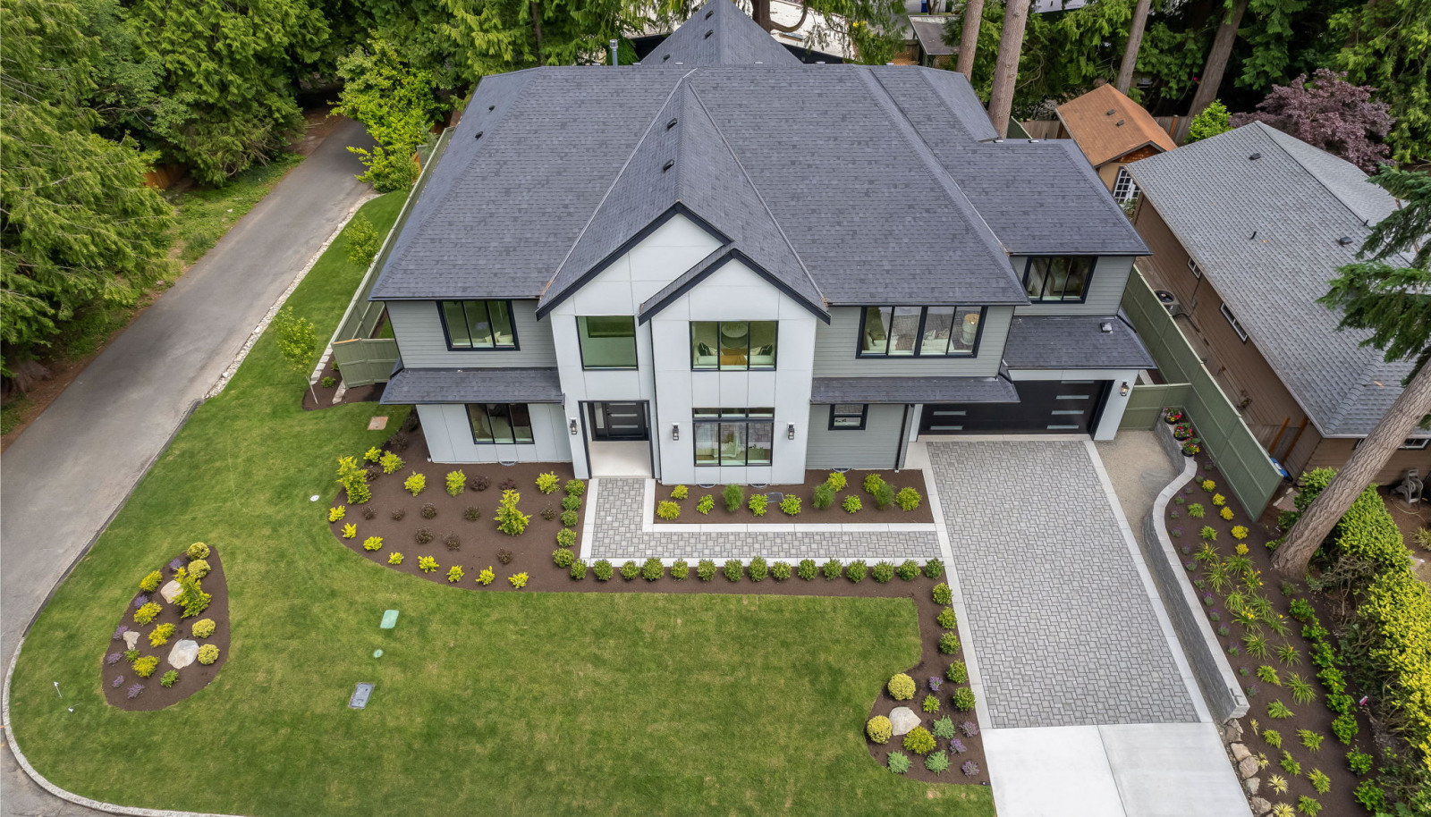 The house perched on a quiet, elevated corner lot surrounded by lush greenery