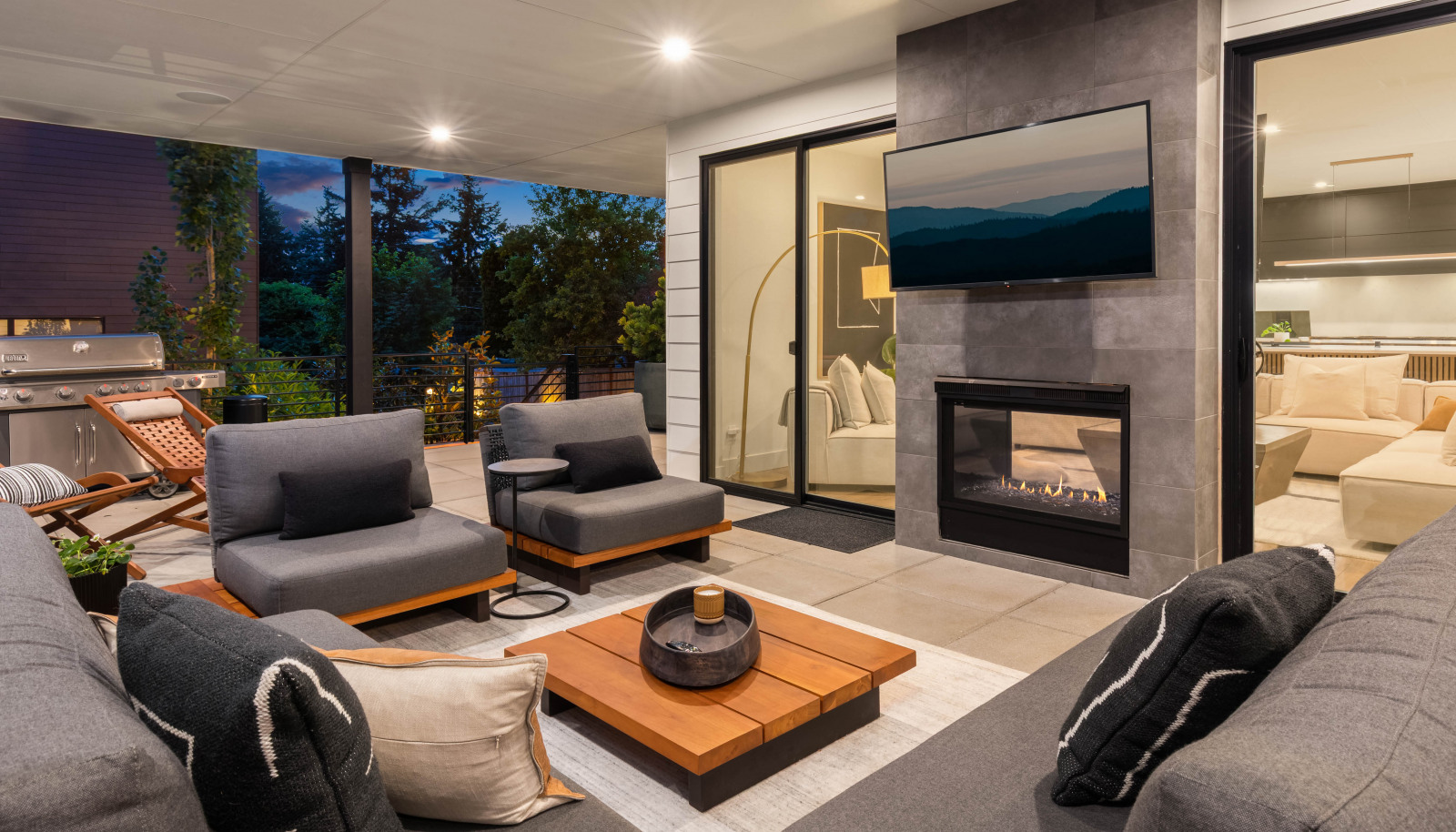 Covered patio with two-sided gas fireplace.