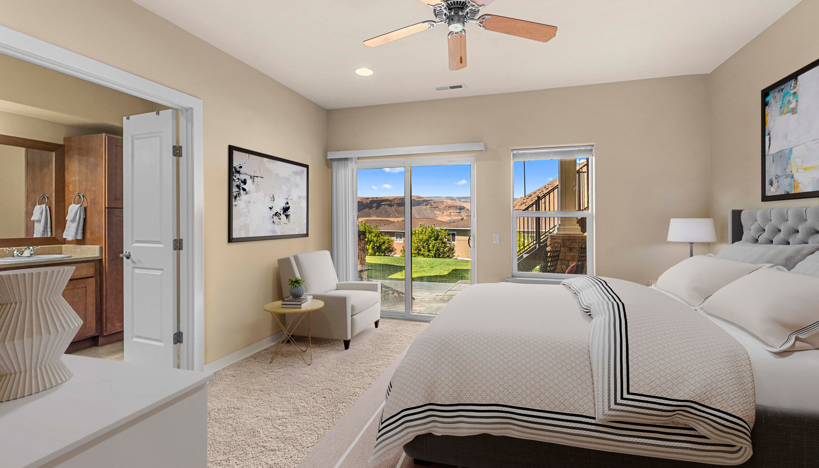 Tranquil primary bedroom with generous layout and large windows for natural light
