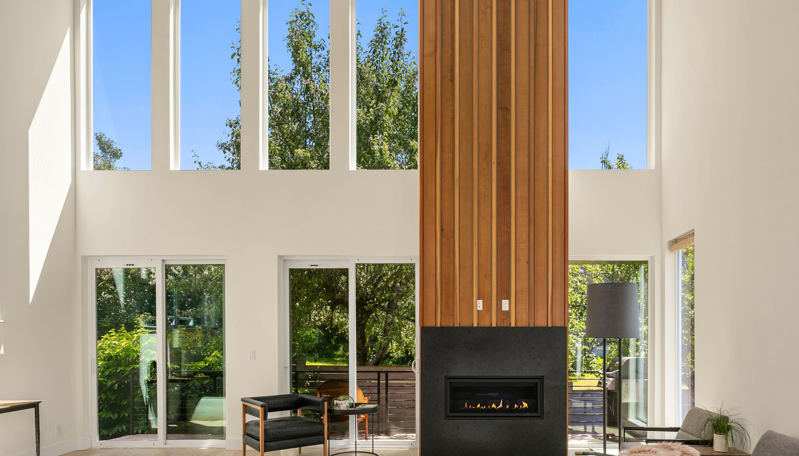 20' ceilings with double stacked windows and impressive fireplace