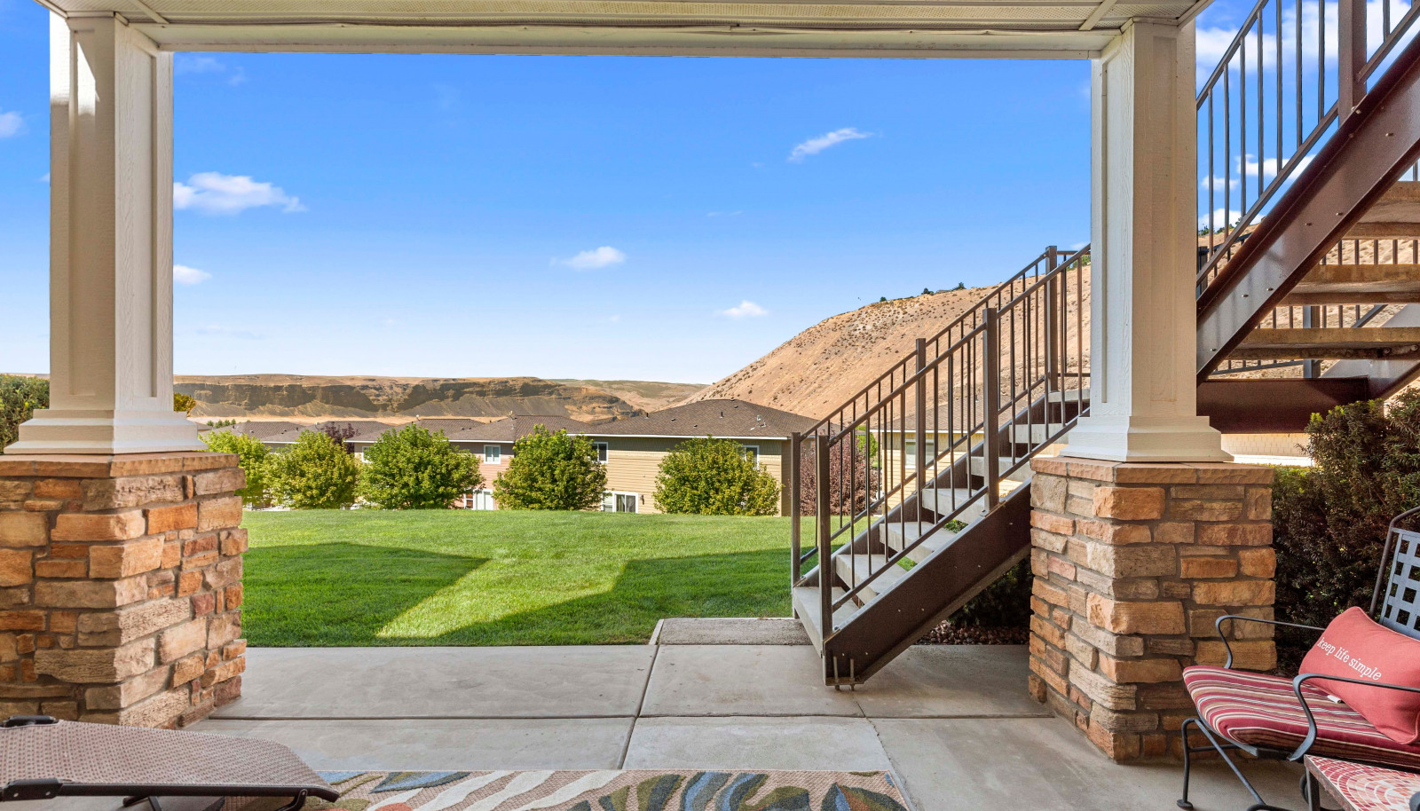 Covered outdoor living space with expansive views - perfect for lounging or dining