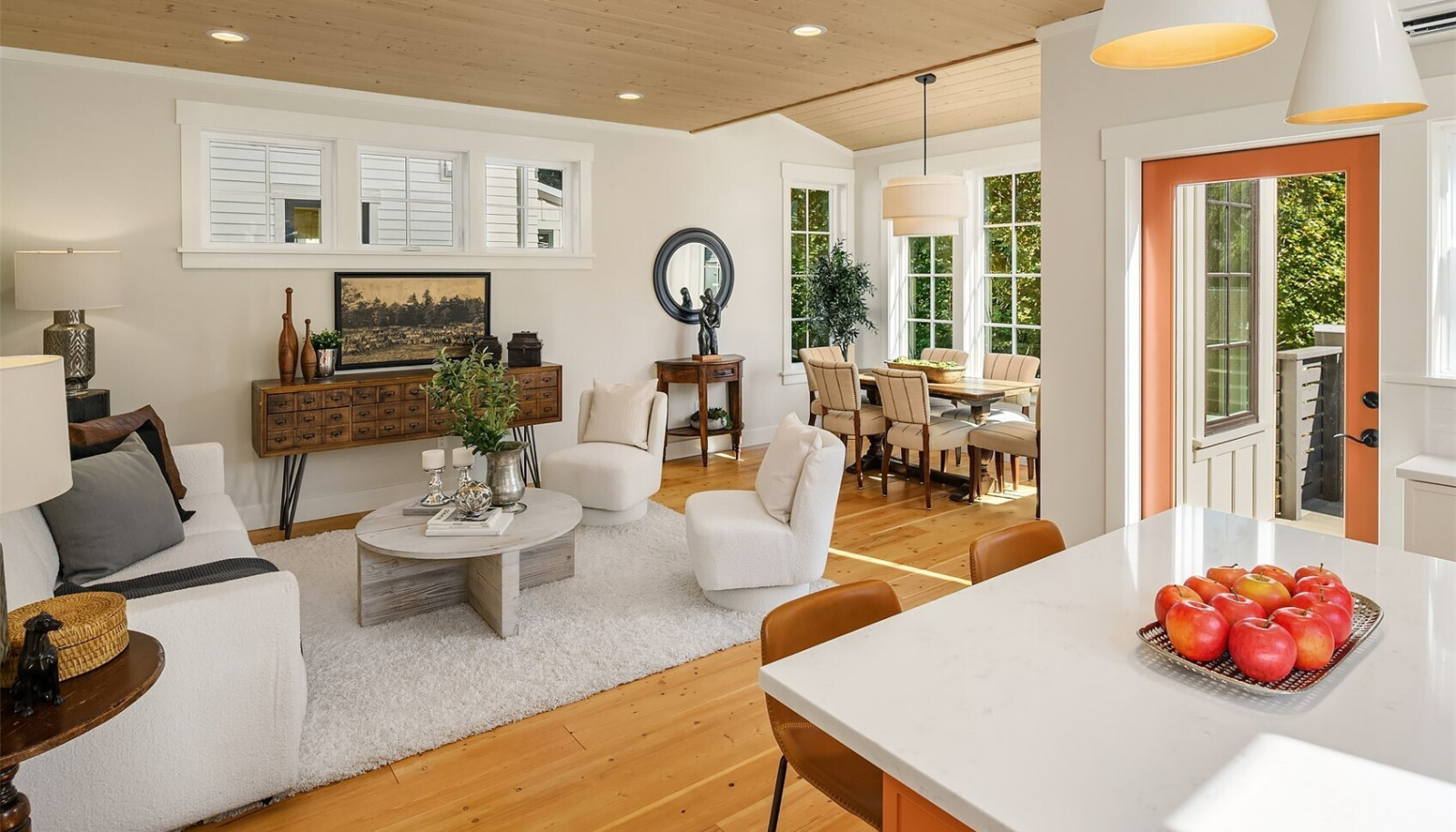 A warm paneled ceiling envelopes the gracious living and dining room that overlooks the lush gardens and woodland beyond. A warm paneled ceiling envelopes the gracious living and dining room that overlooks the lush gardens and woodland beyond.