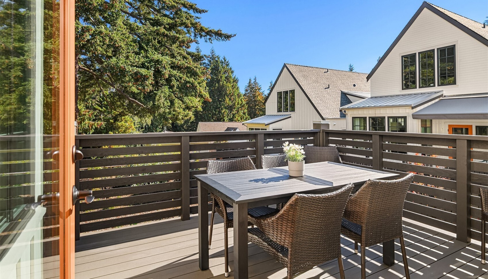 Step out to the large, upper level terrace just steps from the kitchen, living and dining room. Step out to the large, upper level terrace just steps from the kitchen, living and dining room.
