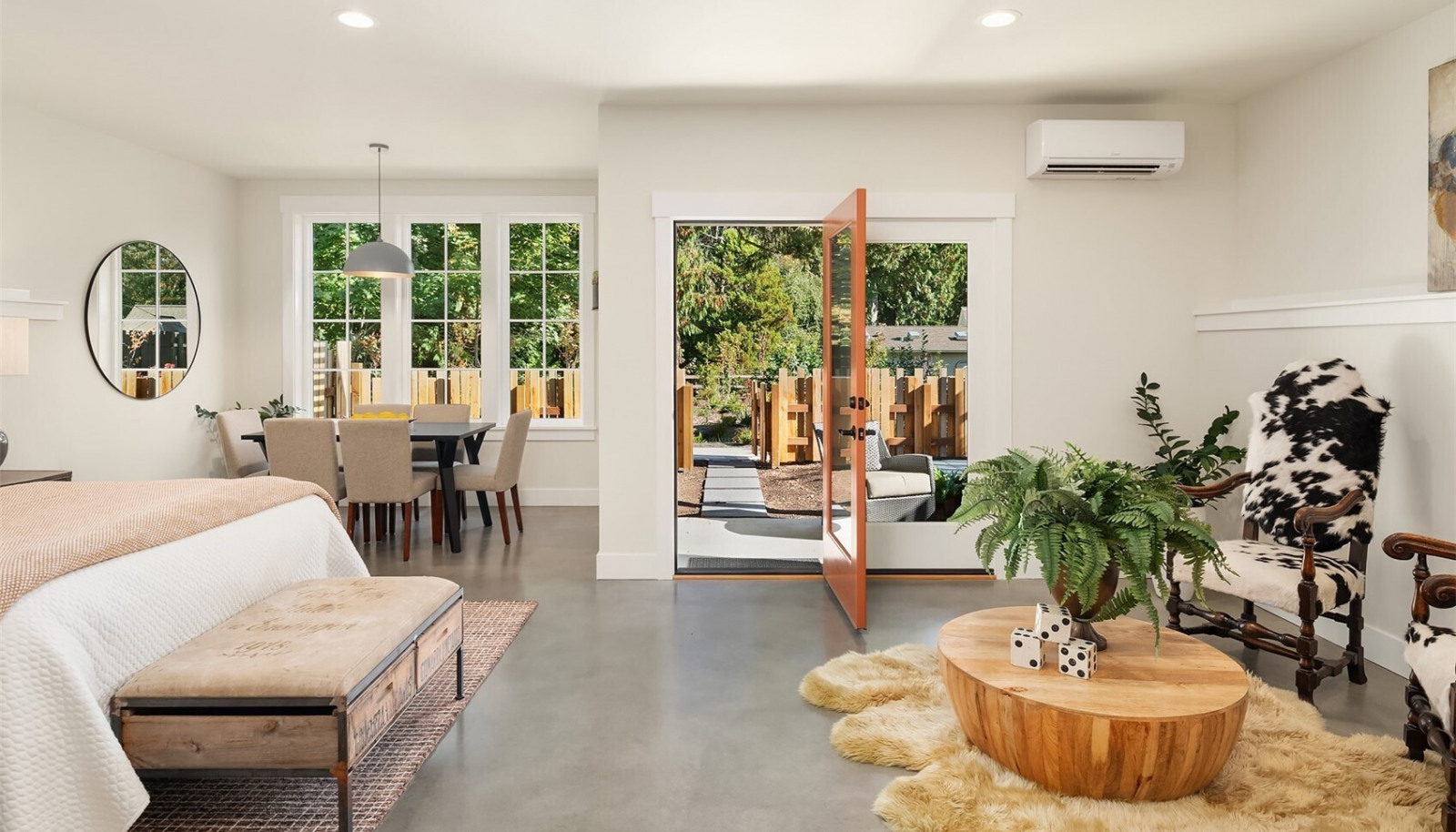 Explore the downstairs studio/flex space with polished concrete floors, wetbar and separate private entry to a patio and fenced rear yard. Explore the downstairs studio/flex space with polished concrete floors, wetbar and separate private entry to a patio and fenced rear yard.