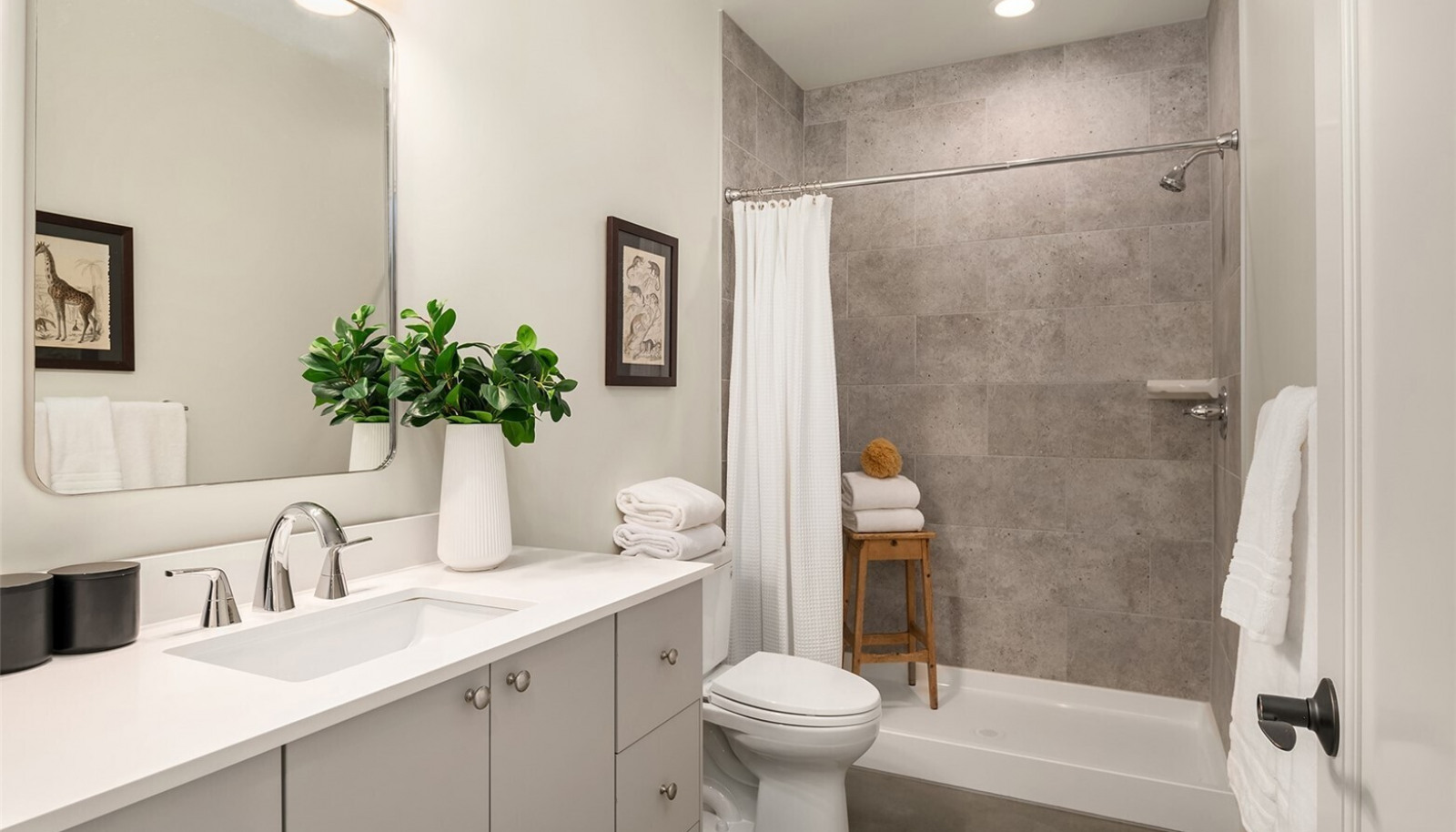 A generous walk in tiled shower is featured in the large lower level bathroom. A generous walk in tiled shower is featured in the large lower level bathroom.