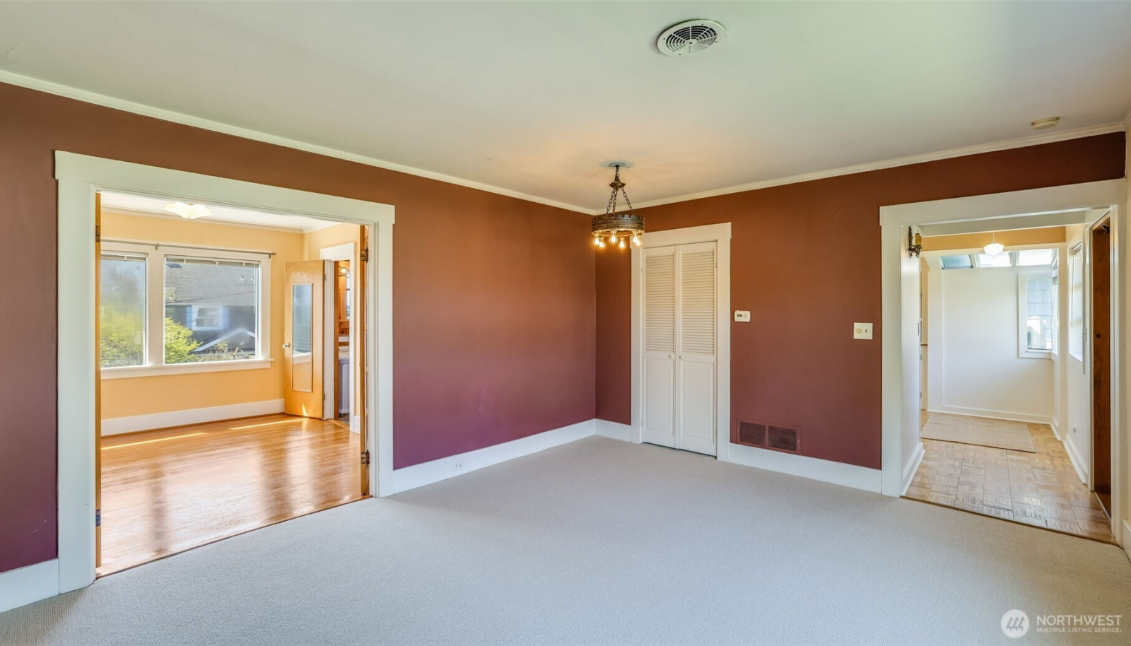 Upstairs: Living room, looking back towards entrance and into primary bedroom. Upstairs: Living room, looking back towards entrance and into primary bedroom.
