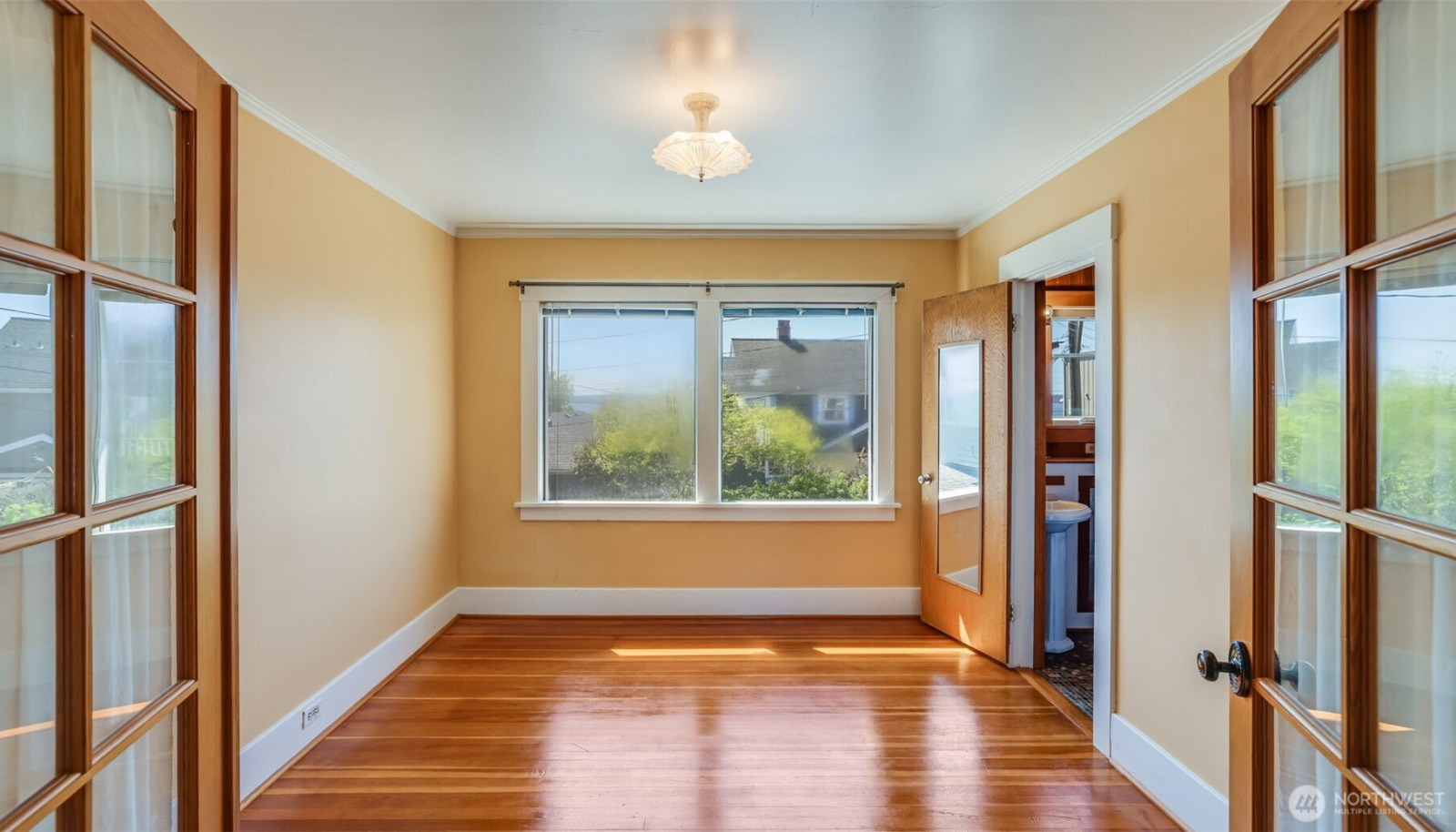 Upstairs: French doors to primary bedroom. Upstairs: French doors to primary bedroom.