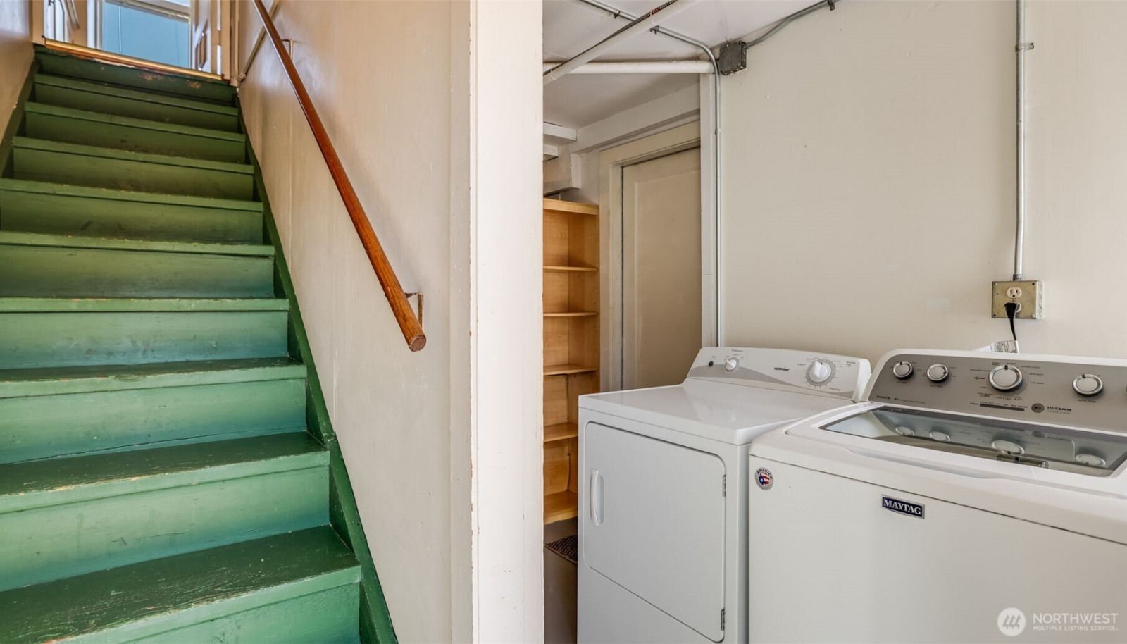 Stairwell still connects the two floors. There is a laundry and storage area that separates the two. Each unit has a door that locks to this shared space. Stairwell still connects the two floors. There is a laundry and storage area that separates the two. Each unit has a door that locks to this shared space.
