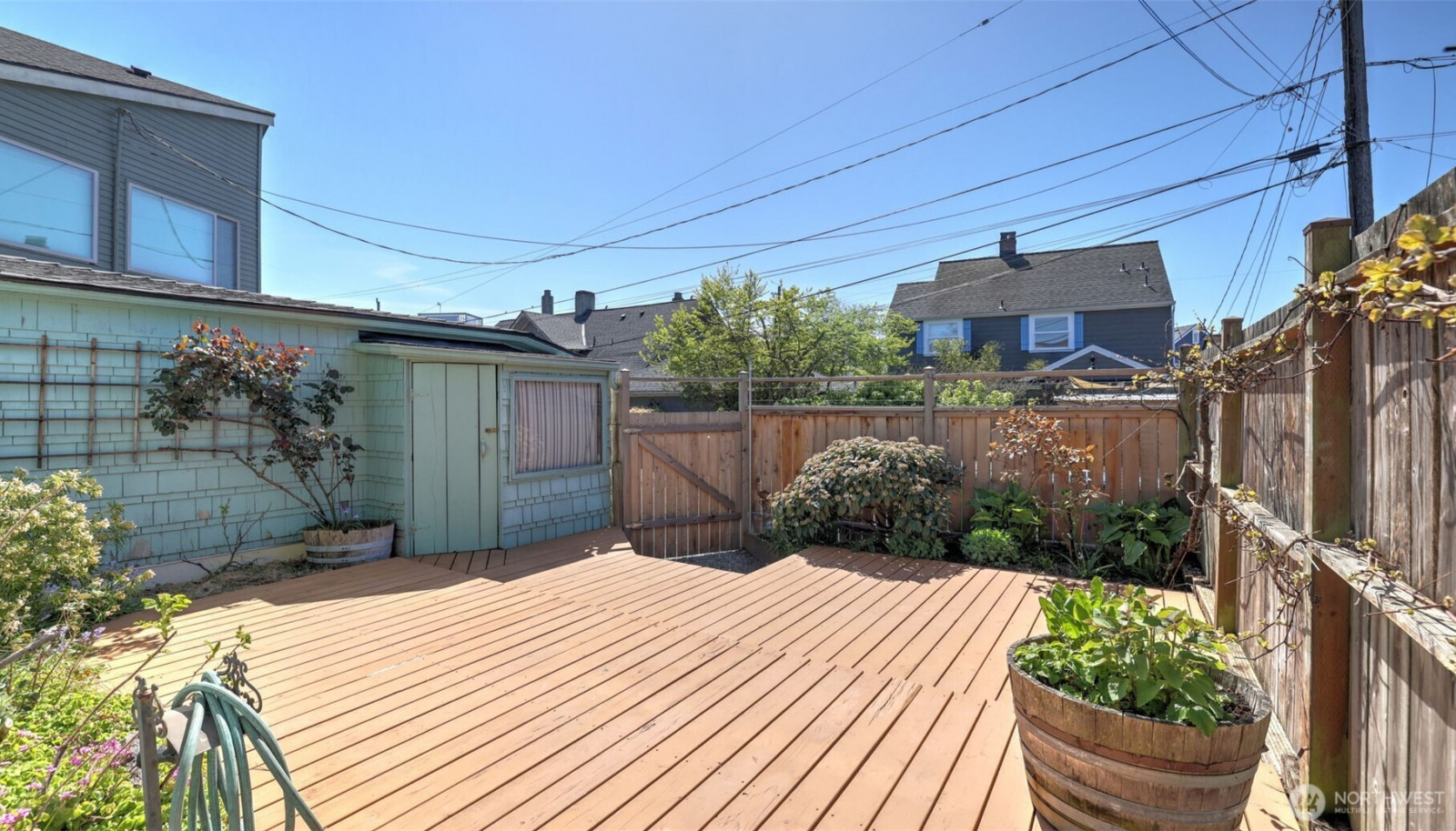 Fenced in back deck with southern exposure. Fenced in back deck with southern exposure.