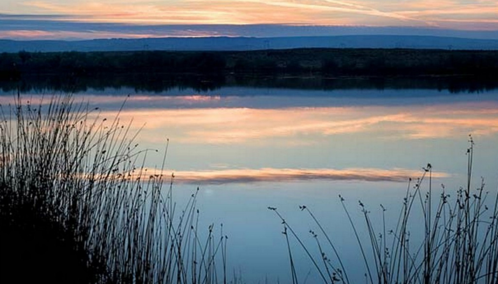 One of three lakes on the property. 60 acres of lakes offering fishing, duck hunting and home site lots with stunning views. One of three lakes on the property. 60 acres of lakes offering fishing, duck hunting and home site lots with stunning views.
