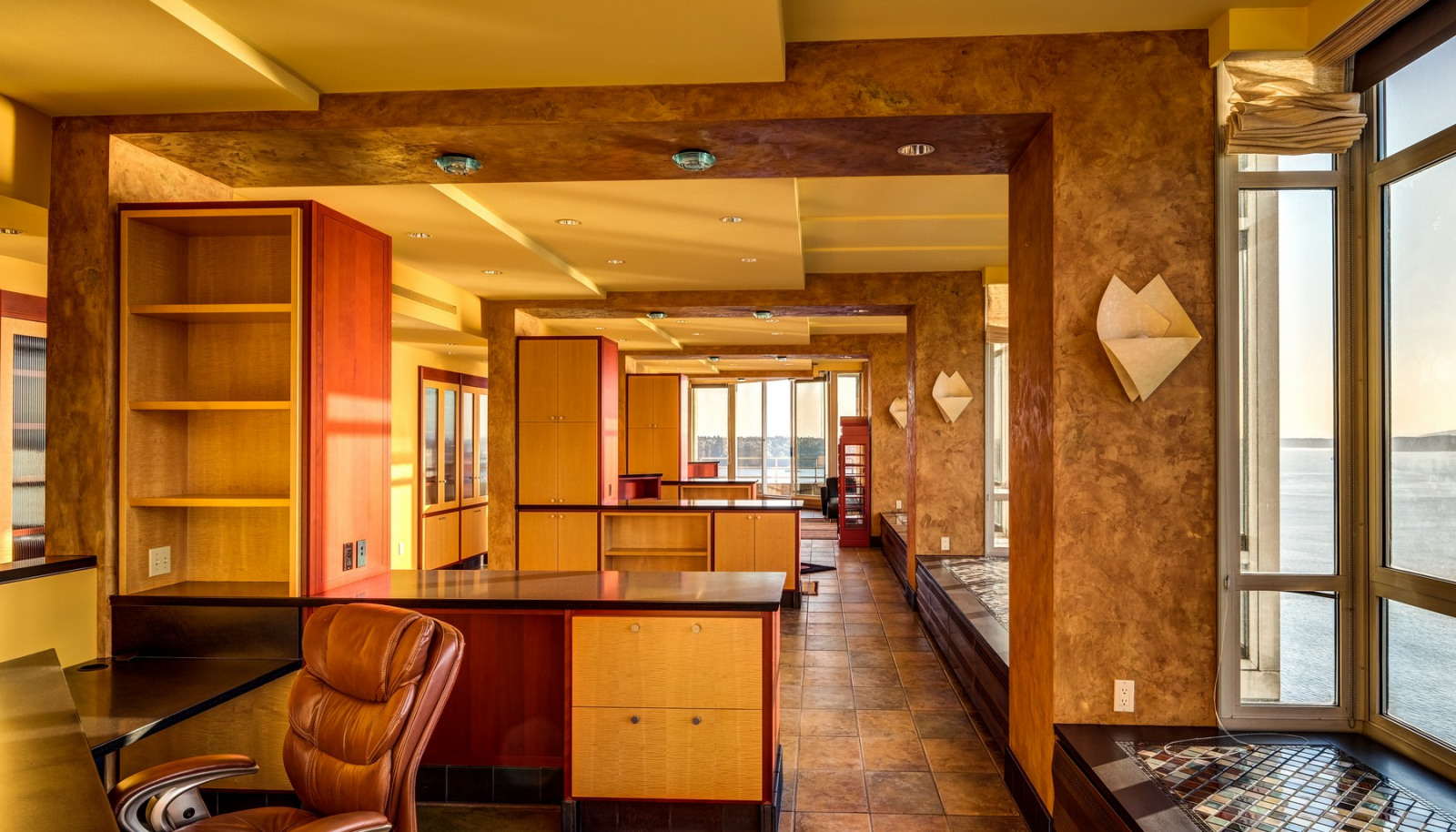 Built-in desk with open concept office space connects with the living space and the view.