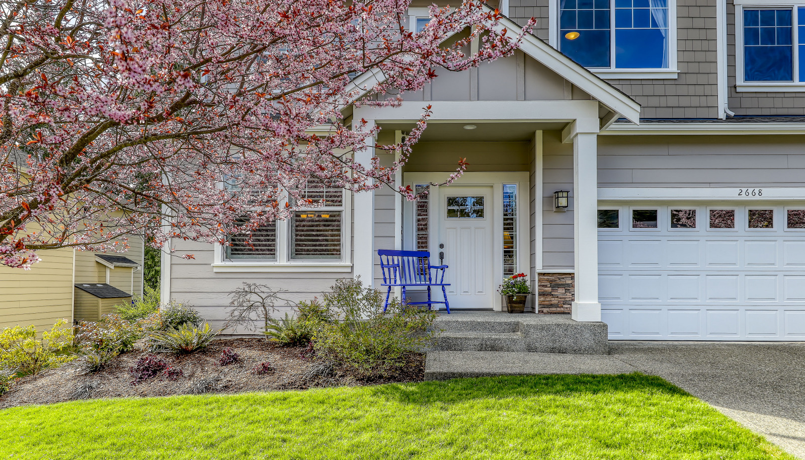 Approach to the covered  front porch.