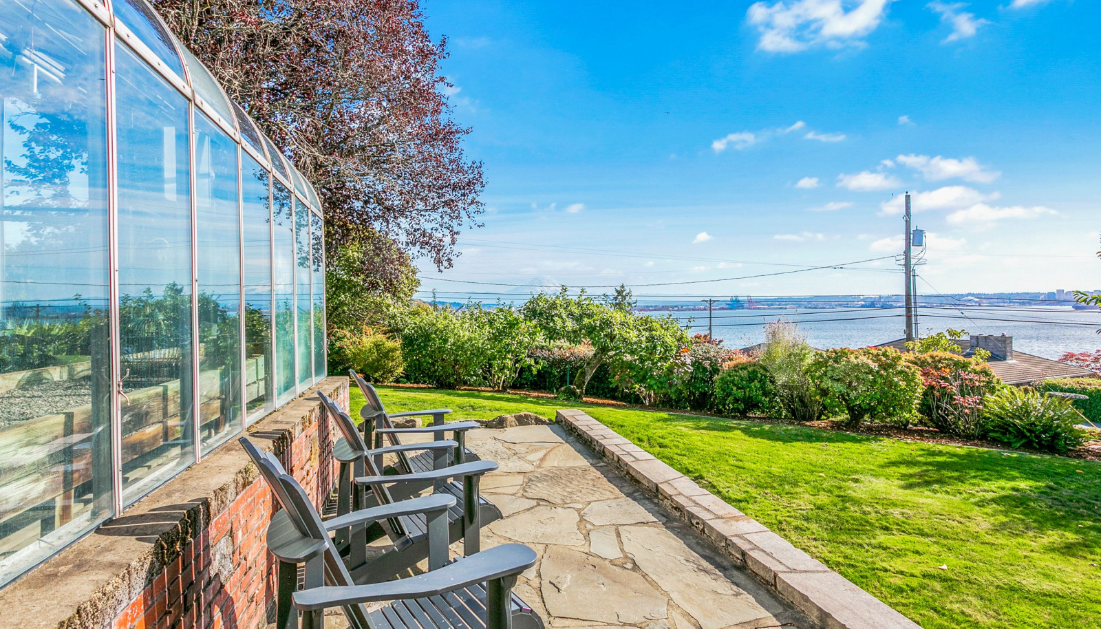 View from side yard to Commencement Bay and breathtaking Mount Rainier (looms large on a clear day)!