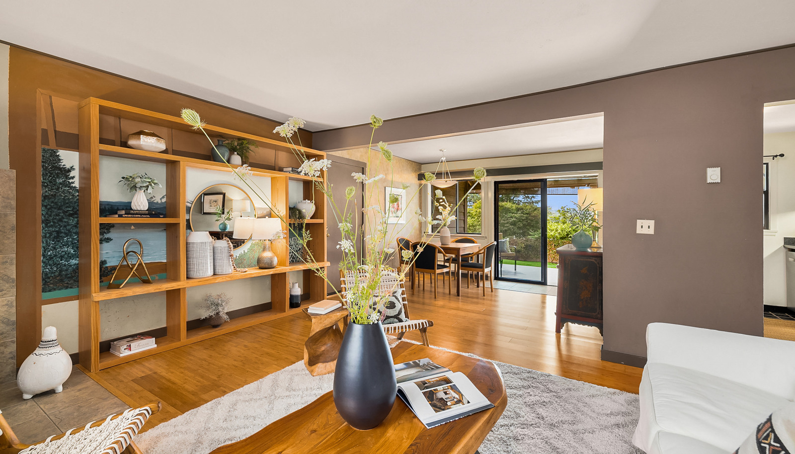 Living room, dining room, open to the sunny back yard.