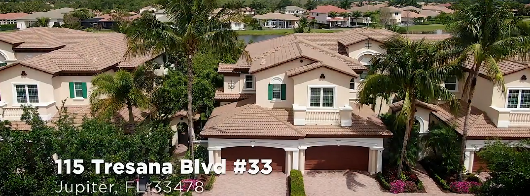 Breathtaking Lake Views from this Prime Waterfront Townhome in the Luxury Gated Community of the Jupiter Country Club!