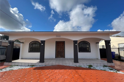 Attractive home with stamped concrete circular drive way.