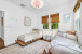 2nd Bedroom with 2 Twin Zen-style beds, and a smart TV.