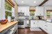 Discover a newly updated kitchen featuring sleek stainless steel appliances and dining service for 10. Enjoy the convenience of both Keurig and filter coffee options in this fully equipped culinary space.