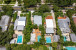 Aerial views of this exquisite villa with private guest house, pool and outdoor amenities to enjoy with family & friends.