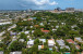 Aerial views of this exquisite villa with private guest house, pool and outdoor amenities to enjoy with family & friends.
