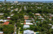 Aerial views of this exquisite villa with private guest house, pool and outdoor amenities to enjoy with family & friends.