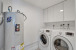 In-unit laundry room next to kitchen/powder room.