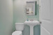 Powder room next to kitchen.
