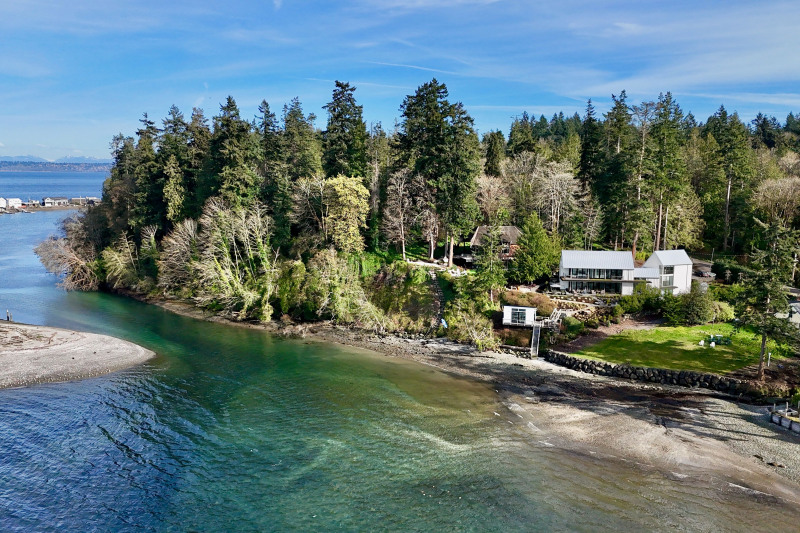 A modern masterpiece, set on a half acre with 82 feet of private, pristine shoreline