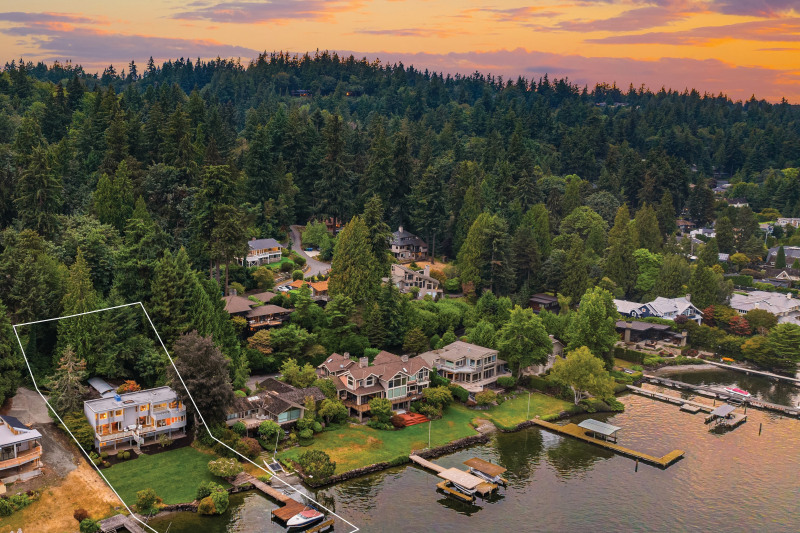 This exceptional waterfront home boasts 85' of prime lake frontage on a sprawling 0.58-acre lot. The rectangular lines are for demonstration purposes only & do not represent the actual property line.
