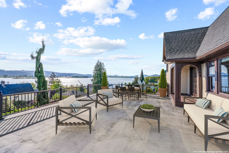Expansive deck overlooks the Columbia River and Puget Island. Note: Deck virtually staged