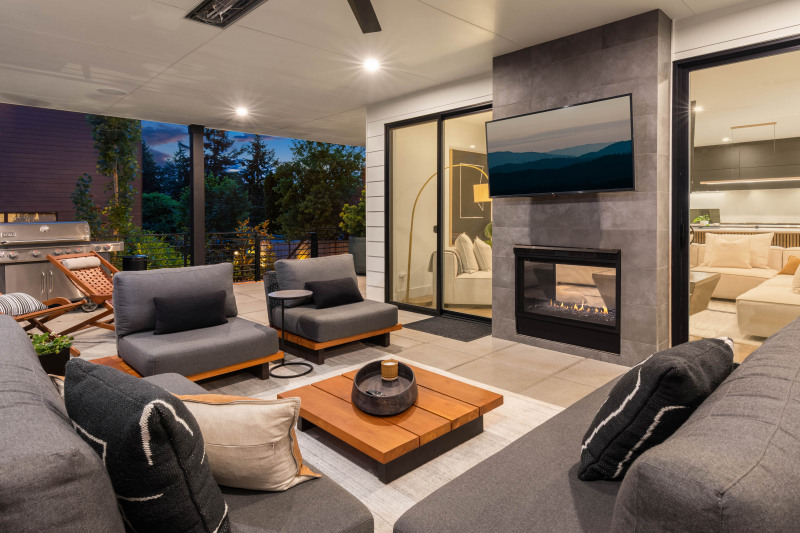Covered patio with two-sided gas fireplace.
