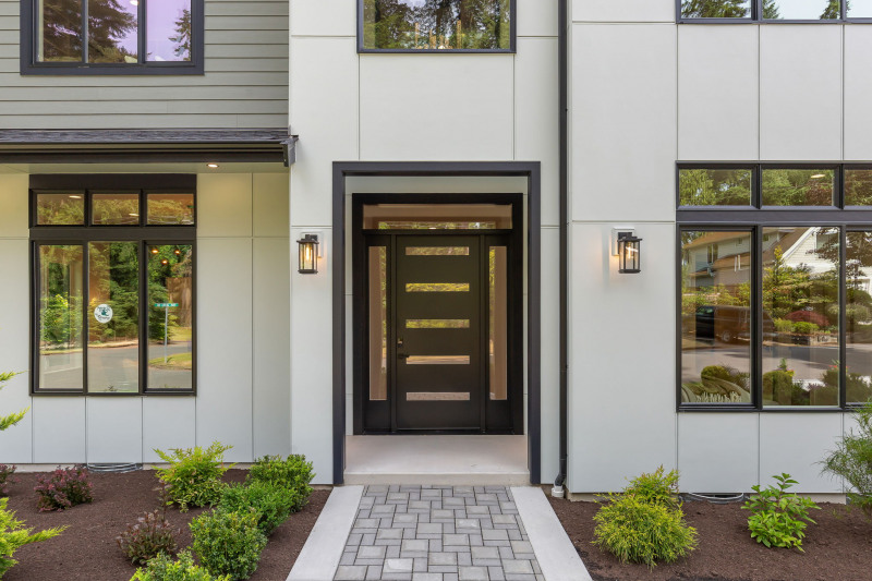Impressive two-story covered foyer designed for both style and privacy.