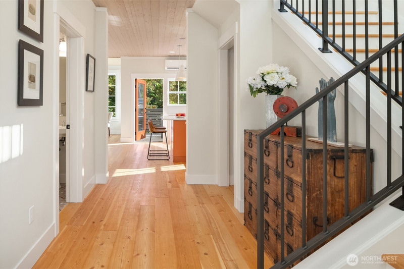 Gleaming solid wood floors grace the homes entry, living spaces and bedrooms. Gleaming solid wood floors grace the homes entry, living spaces and bedrooms.