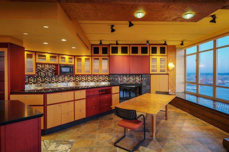 Meticulous custom designed maple and anigre hardwood cabinetry are found throughout.
