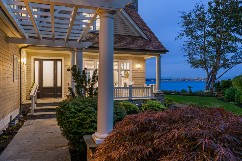 Approach to this stunning home's entry at dusk.