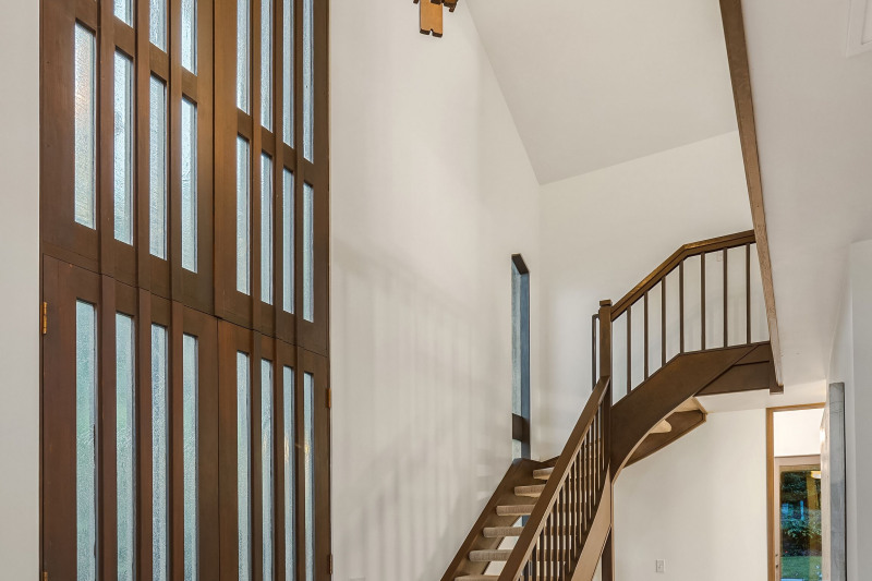 The cathedral ceilings throughout and the two-story entry hall provide a spacious feel and unique ambiance.