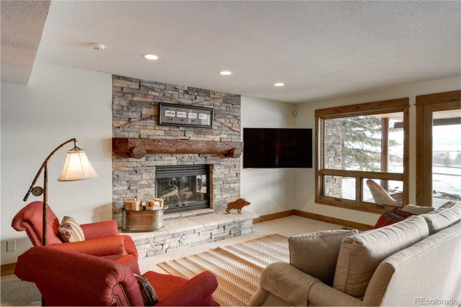 Family room on the lower level with access to the hot tub on the patio